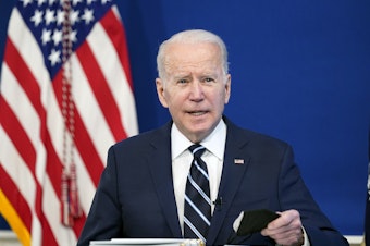 caption: President Biden speaks about the government's COVID-19 response in the Eisenhower Executive Office Building on Thursday.