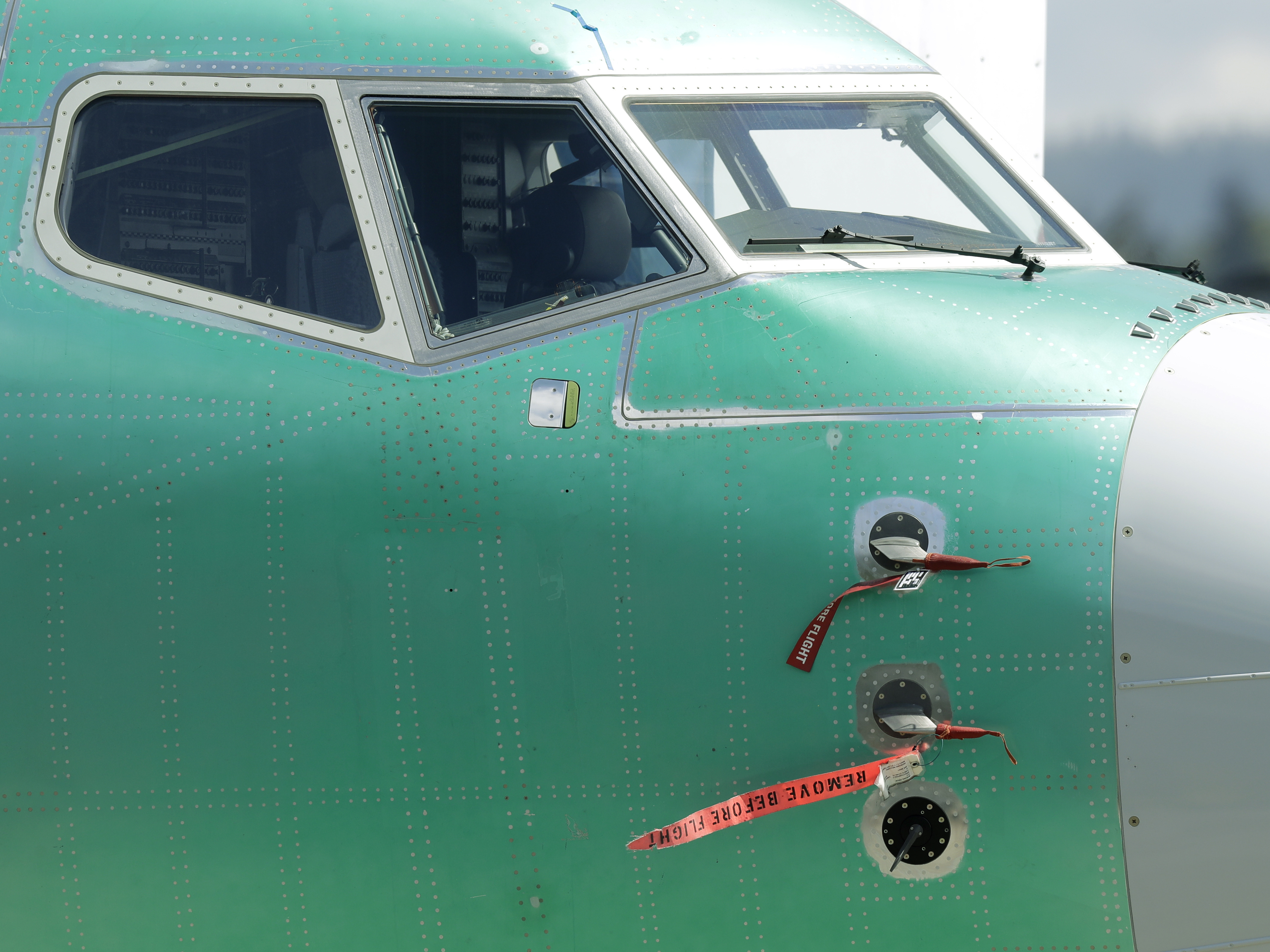 caption: Caution flags are shown on flight sensors on a Boeing 737 Max 8 airplane being built for Ukraine International Airlines at Boeing's assembly facility in Renton, Wash.
