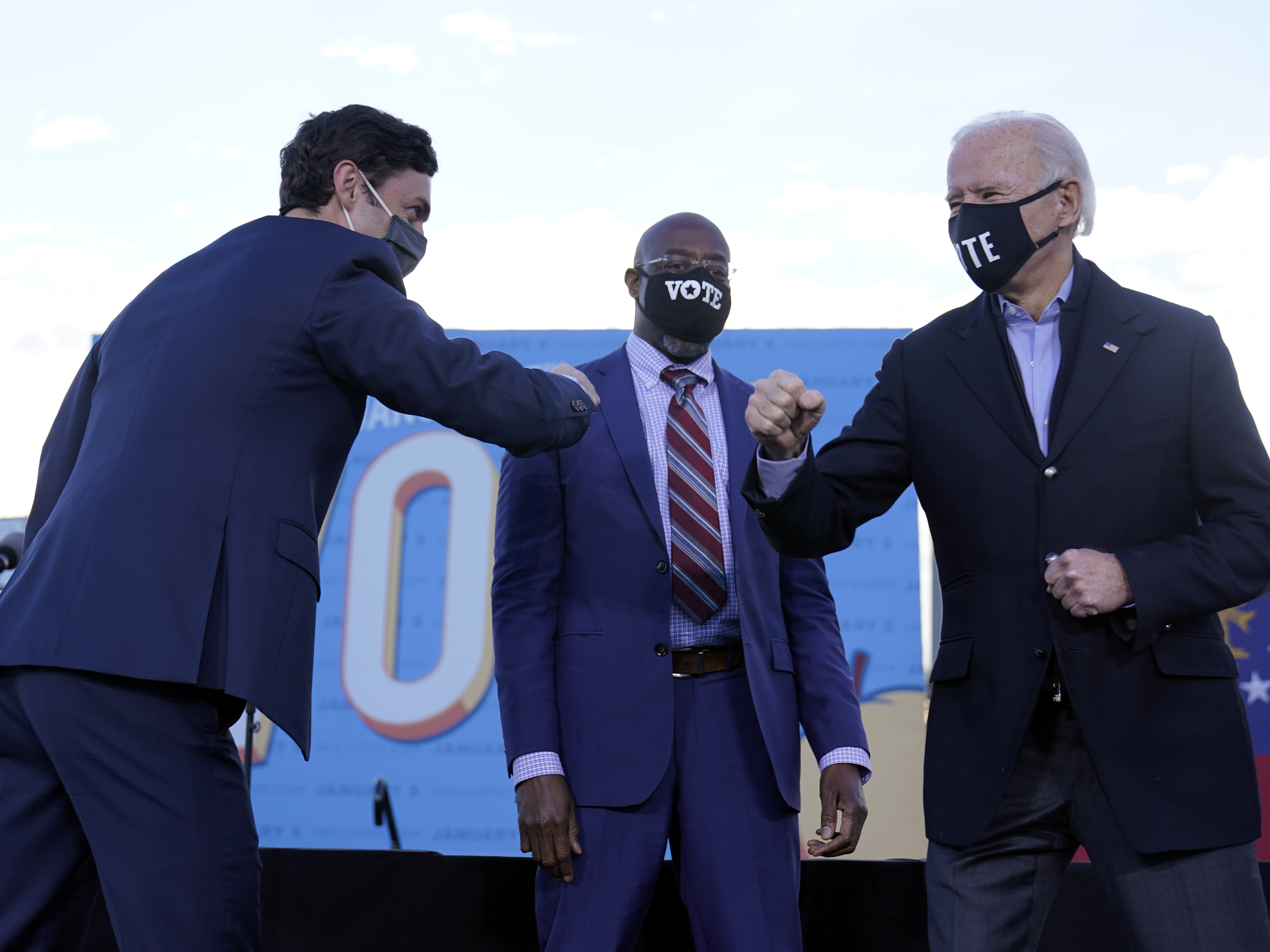 caption: President-elect Joe Biden campaigned in Atlanta for Senate candidates Raphael Warnock (center) and Jon Ossoff (left). President Trump also traveled to Georgia to campaign for the Republican candidates.