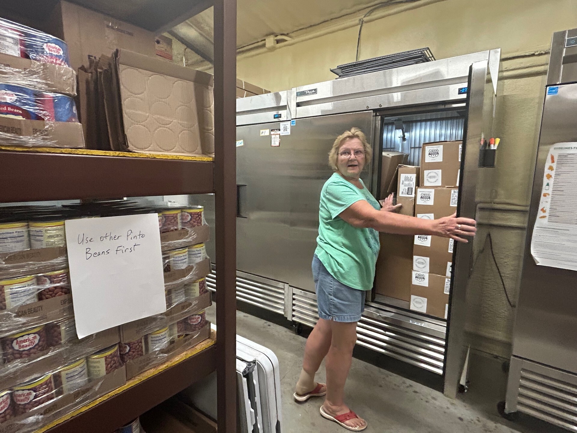 caption: Mary Ann Edwards takes stock of inventory at the Llano Food Pantry in central Texas on October 23, 2025. She said the pantry has seen increased need because of rising costs of goods over the last year. With SNAP benefits set to halt barring Congressional intervention, she expects to see "a bunch of new people coming in."
