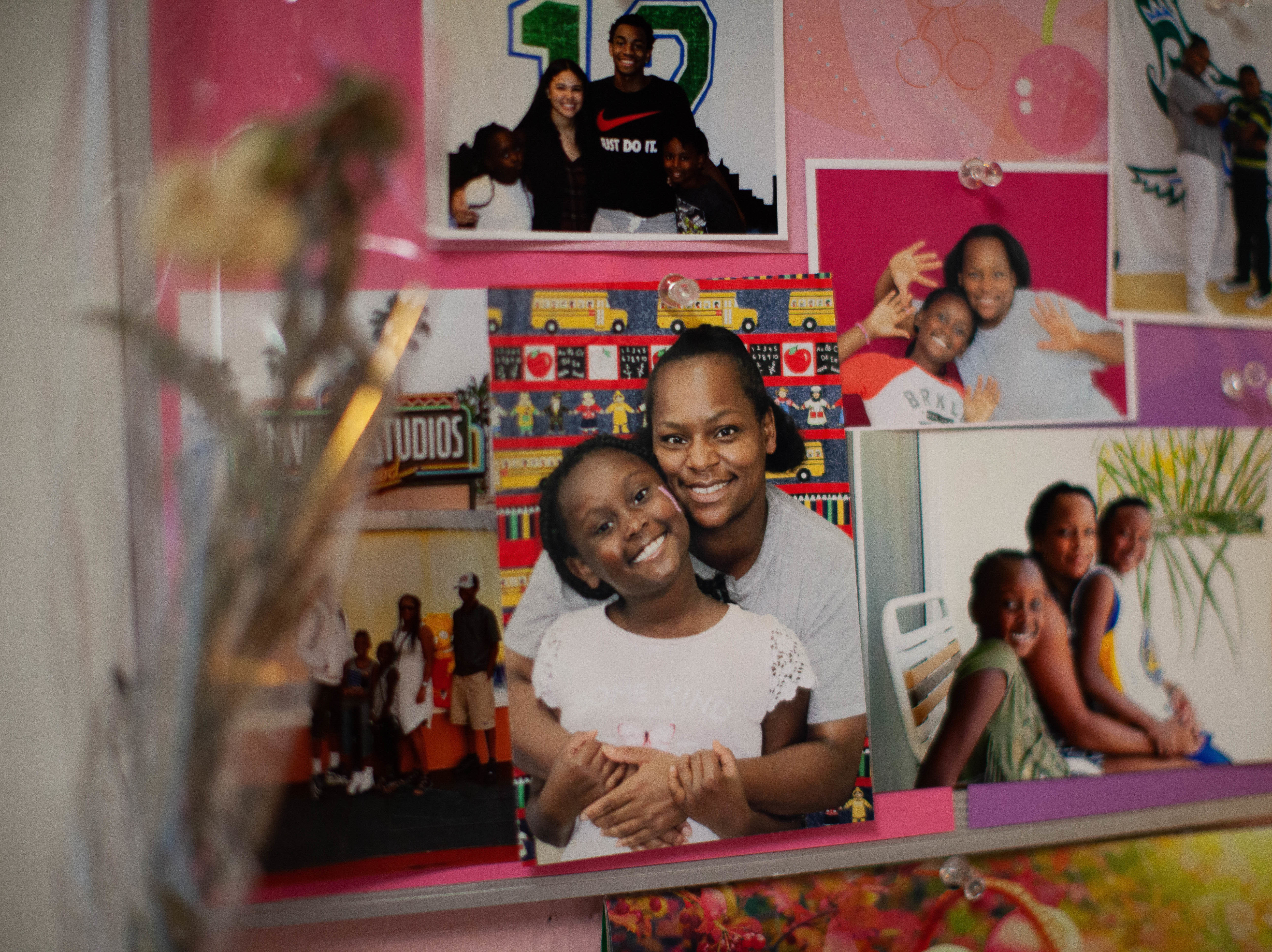 caption: Photos of Daidre Kimp with her children posted on a bulletin board in her room.