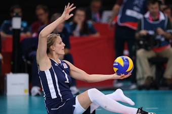 caption: Lora Webster of The United States plays a shot during the Women's Sitting Volleyball final Gold Medal match at the London 2012 Paralympic Games. She'll be competing in Tokyo this year.