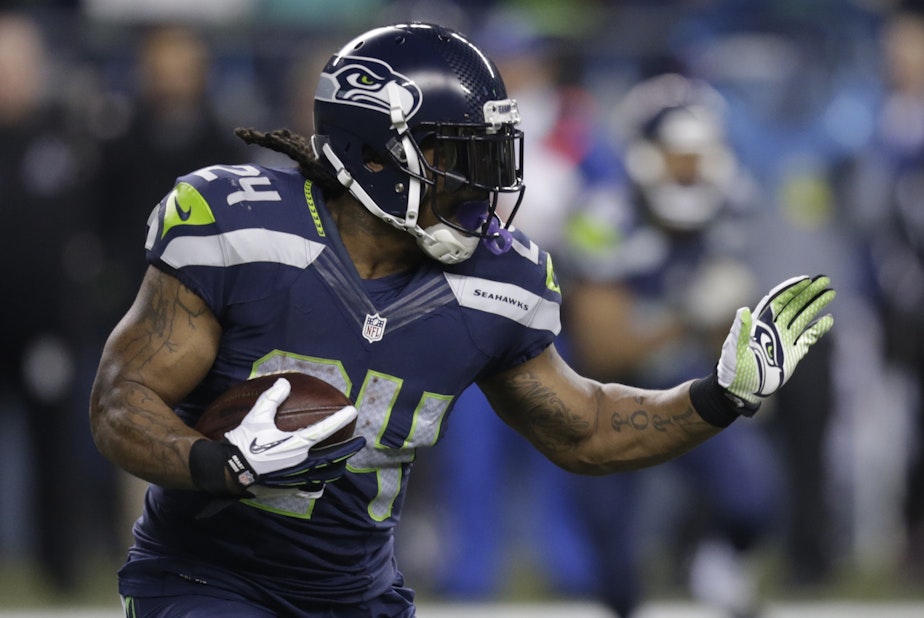 caption: FILE: Seattle Seahawks running back Marshawn Lynch rushes against the Arizona Cardinals in the first half of an NFL football game, Sunday, Nov. 15, 2015, in Seattle. 