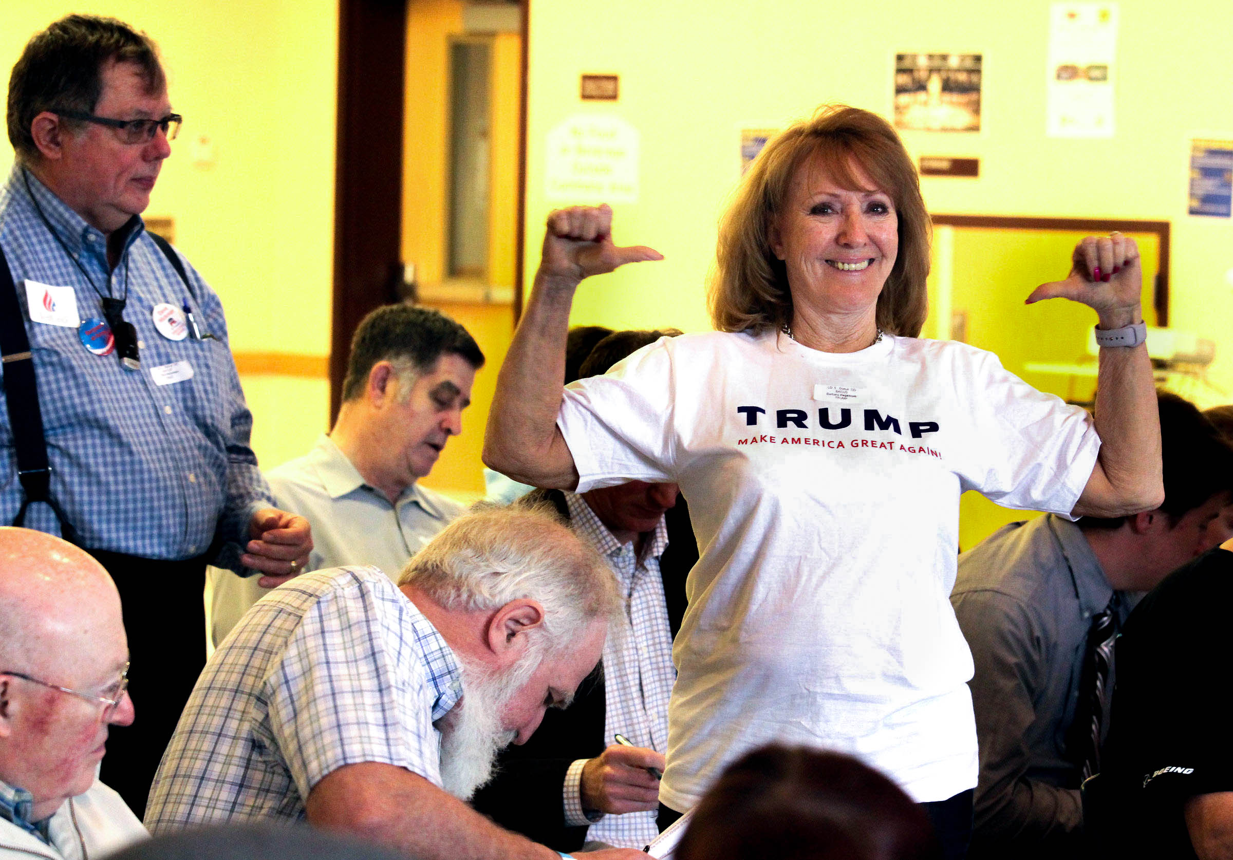 caption: Barbara Hagstrom of Duvall shows off her Trump t-shirt at the 5th Legislative District GOP Caucus. 