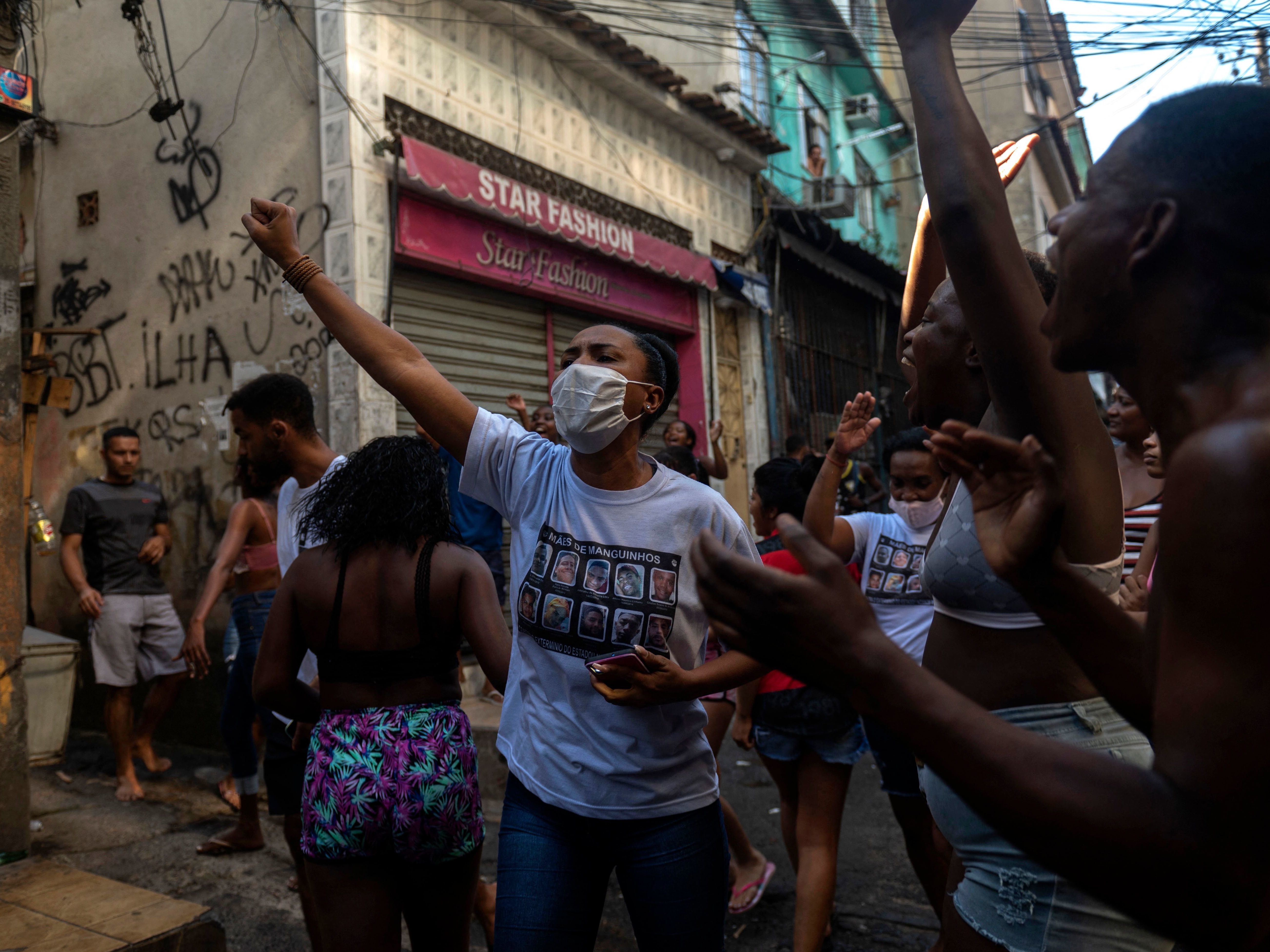 caption: Residentes protest after a police operation against alleged drug traffickers at the Jacarezinho favela in Rio de Janeiro, Brazil, on Thursday.