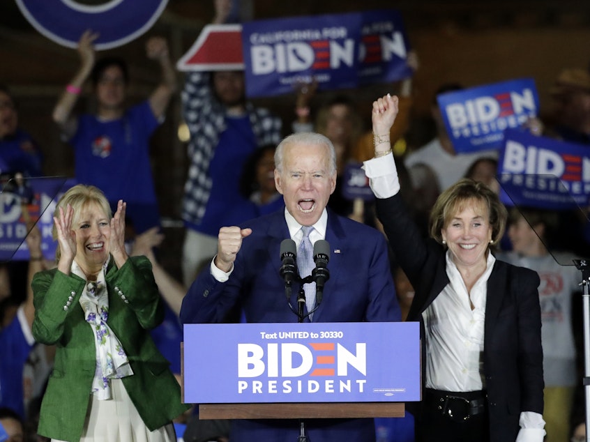 caption: Joe Biden speaks at a campaign rally in Los Angeles with his wife Jill and his sister Valerie. The former vice president rode a wave of momentum that may have catapulted him back into front-runner status.