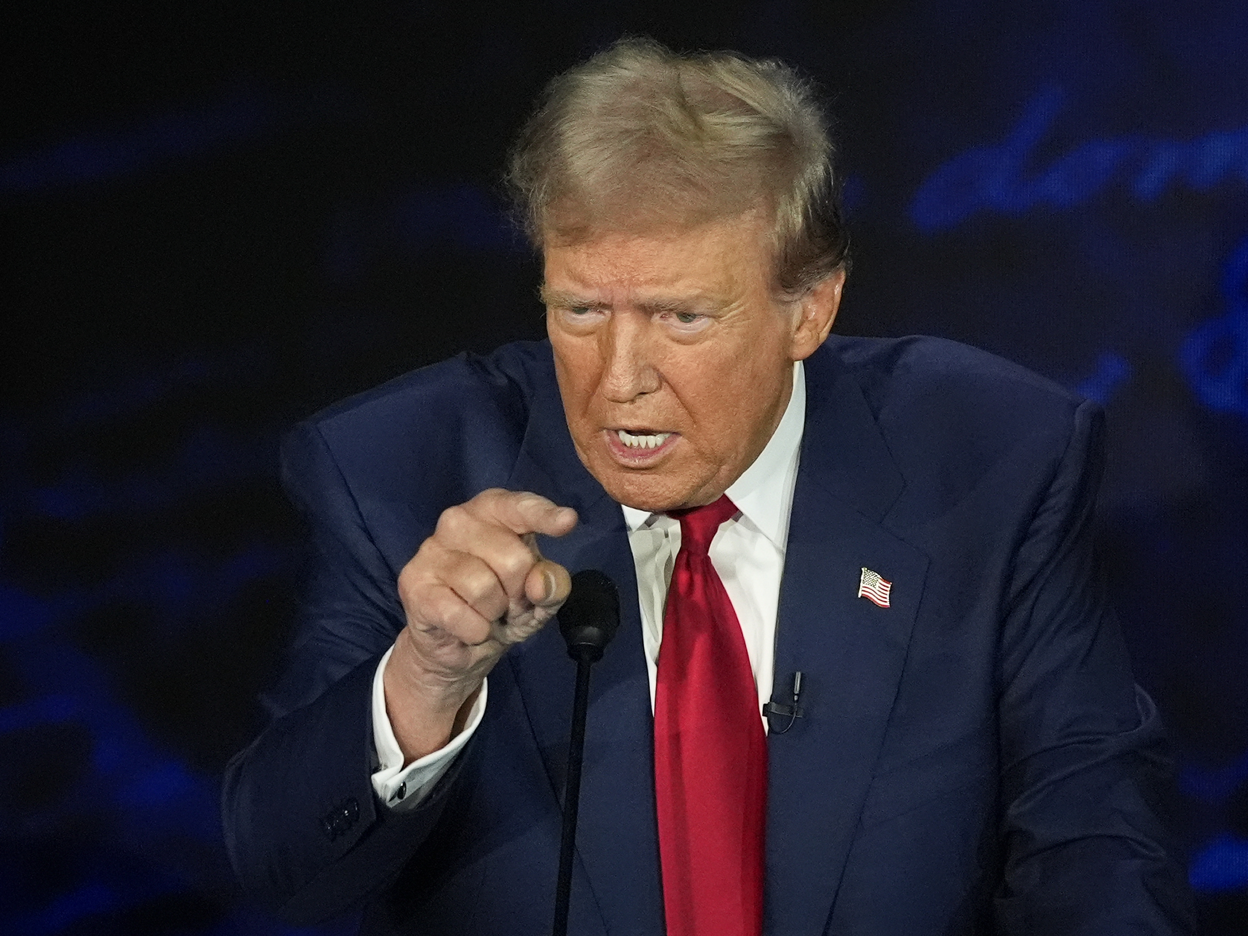 caption: In Tuesday night's debate, former President Donald Trump repeated an unfounded claim that immigrants are eating people's pets.