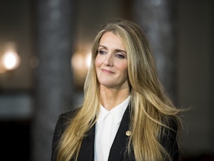 caption: Sen. Kelly Loeffler, R-Ga., waits for Vice President Mike Pence to arrive for her swear-in reenactment for the cameras in the Capitol on Monday, Jan. 6, 2020.