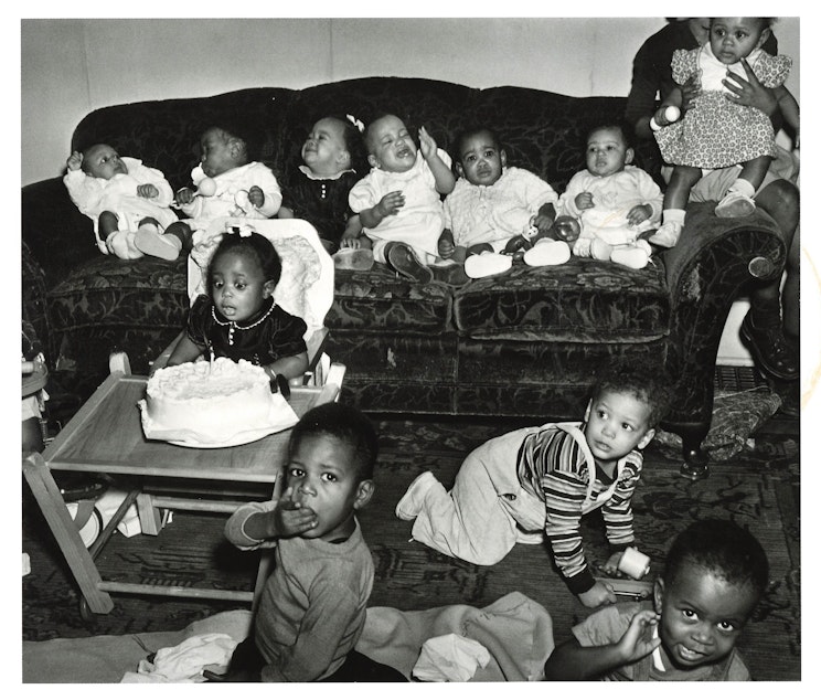 caption: A 1 year old girl celebrates her first birthday, circa 1950. (To help us ID these babies, note the photo number. This is #9.)