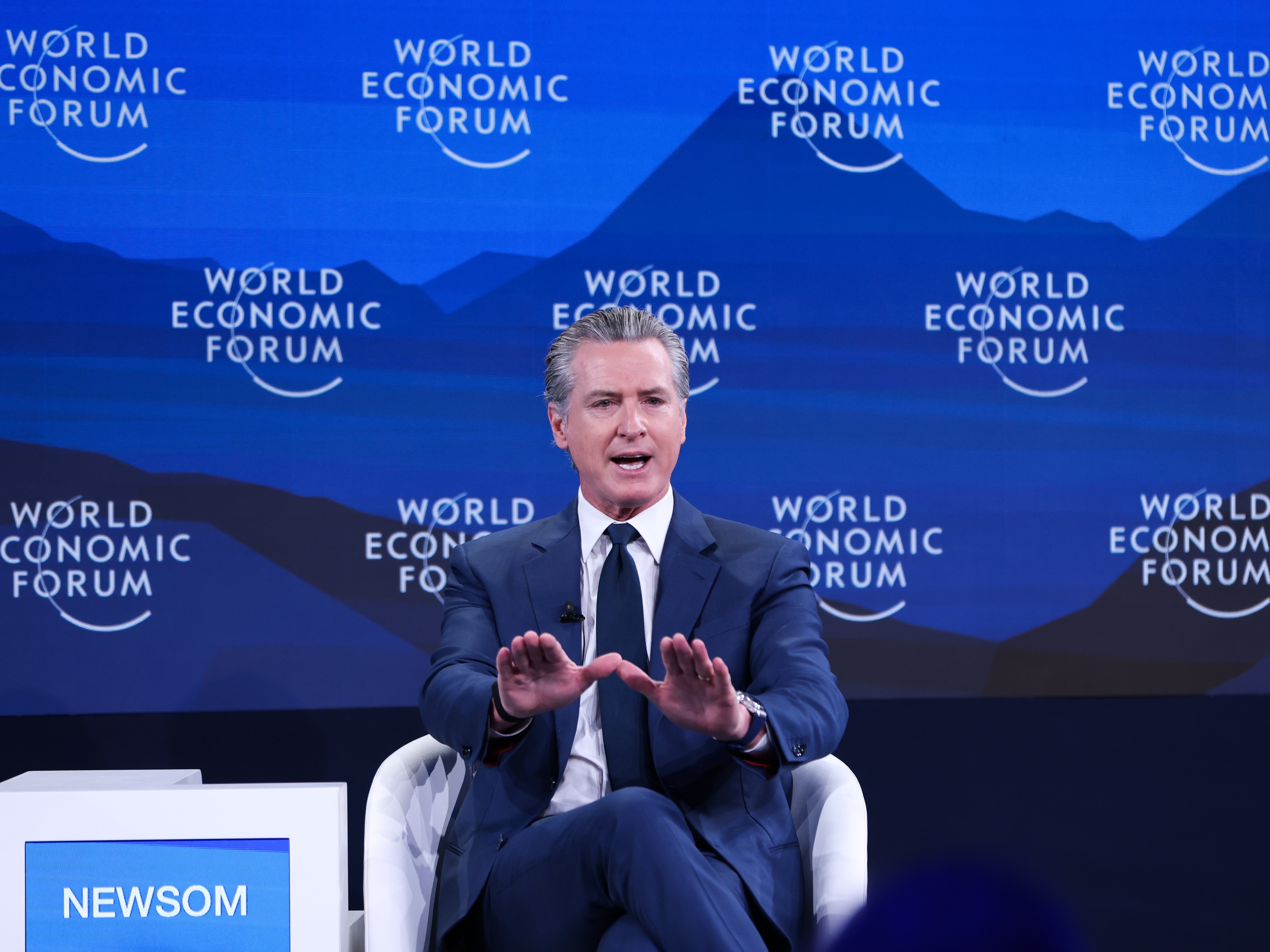caption: Gavin Newsom, governor of California, at the 2026 Davos gathering of political leaders, executives and celebrities. Newsom met with World Health Organization head Tedros Adhanom Ghebreyesus at the event to talk about working together to monitor emerging public health threats.