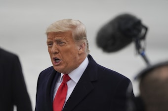 caption: President Trump, seen here during a trip Tuesday to the U.S.-Mexico border, released a statement during Wednesday's House impeachment debate calling on Americans to "ease tensions."