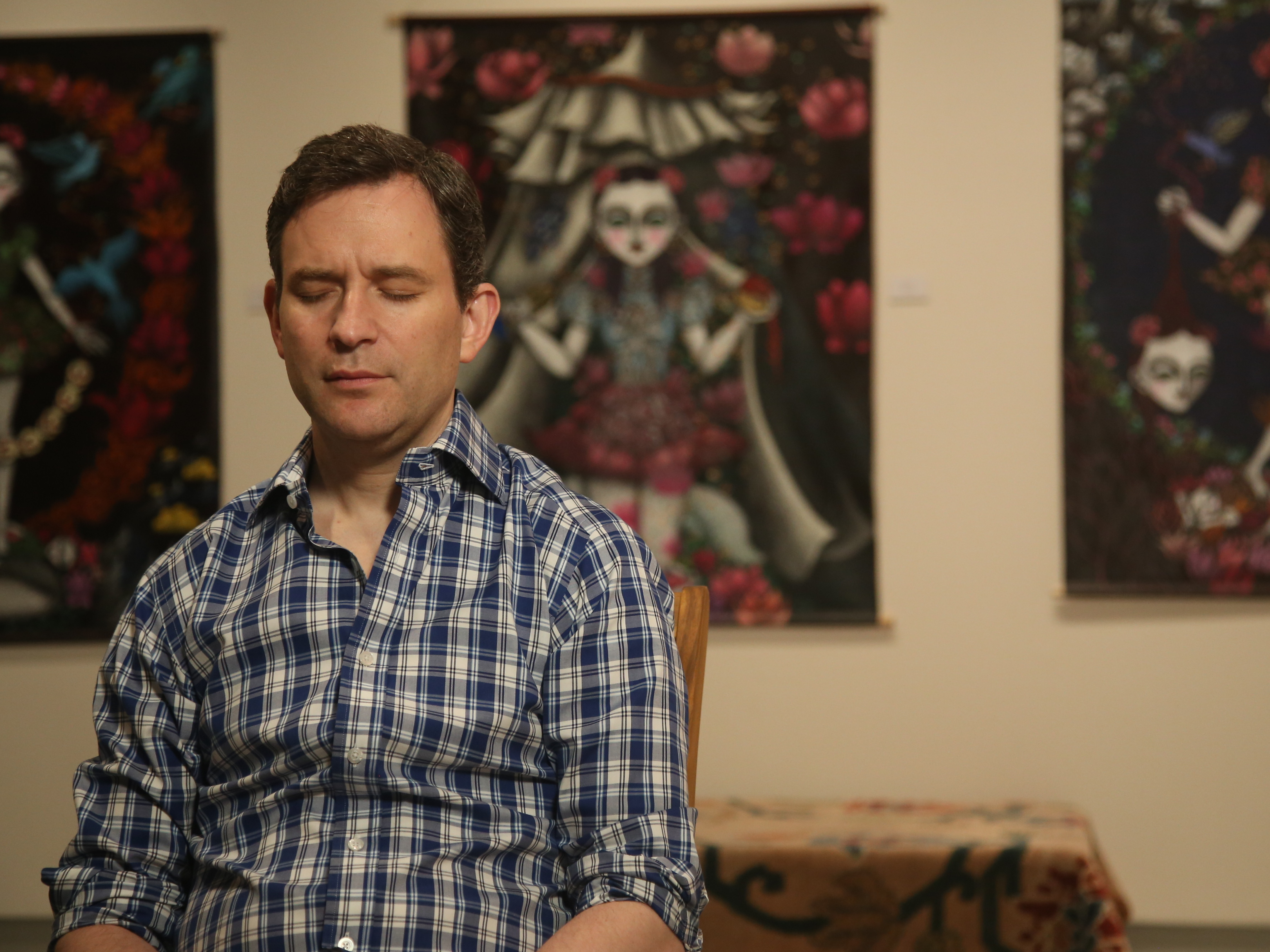 caption: Dan Harris meditating.