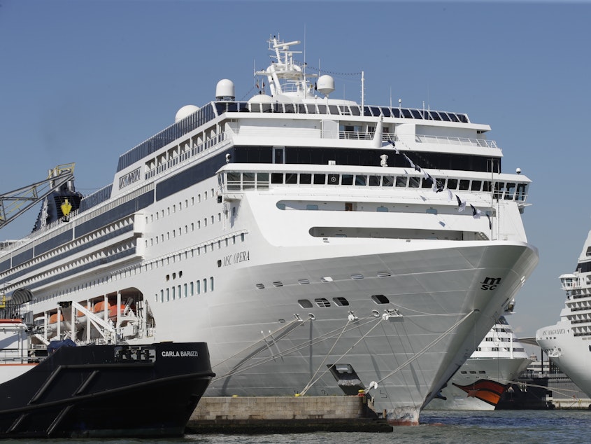 caption: The MSC Opera cruise ship rammed into a dock and a tourist river boat on a busy Venice canal. An investigation is underway into the cause of the crash.