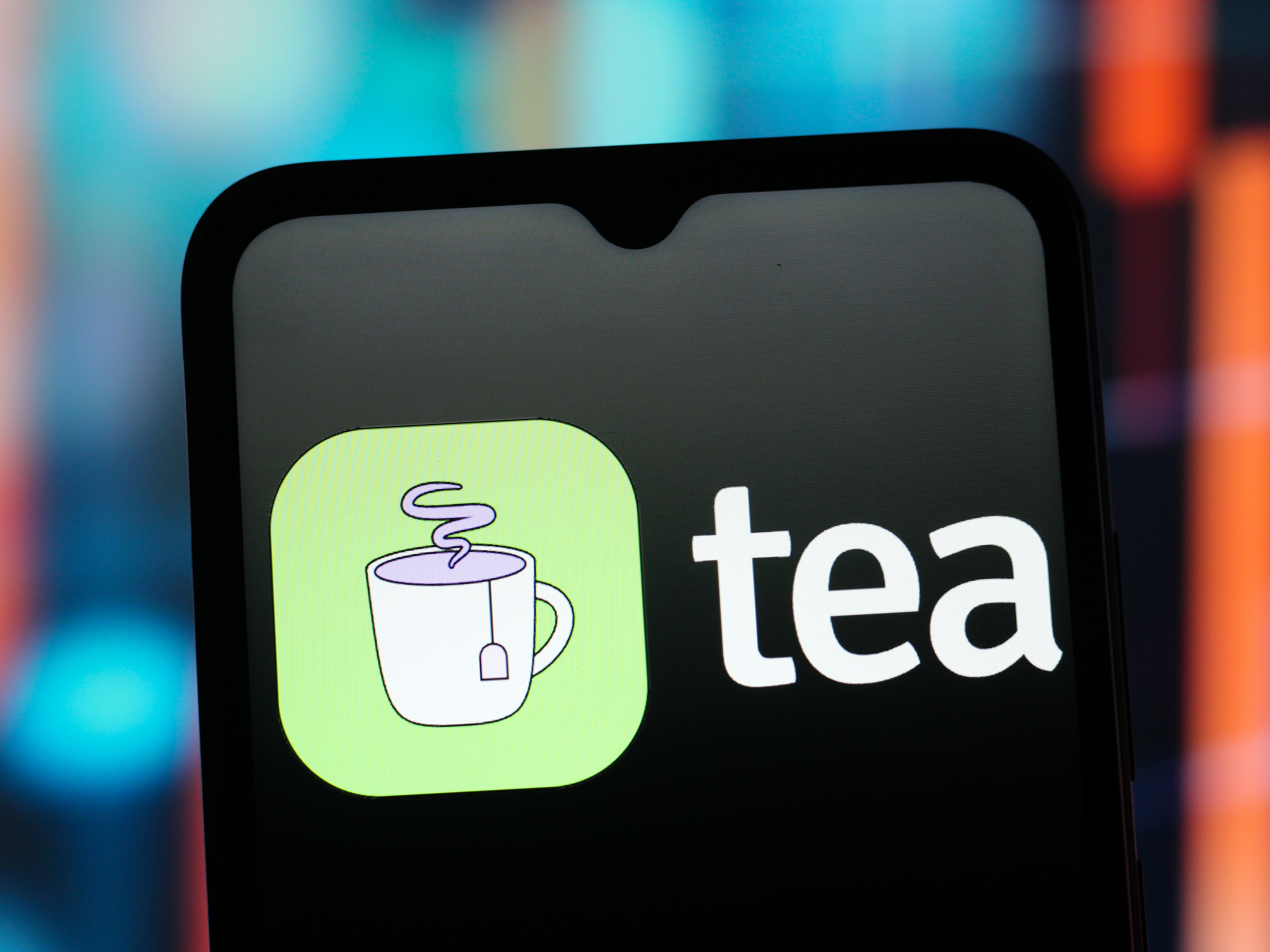 caption: In this photo illustration, the Tea app logo is seen displayed on a smartphone screen. The dating advice app suffered a major data leak last month.