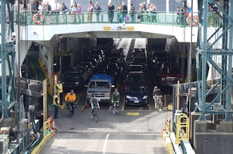 caption: These cyclists did not forget (or 'forget') their bikes on the ferry. 