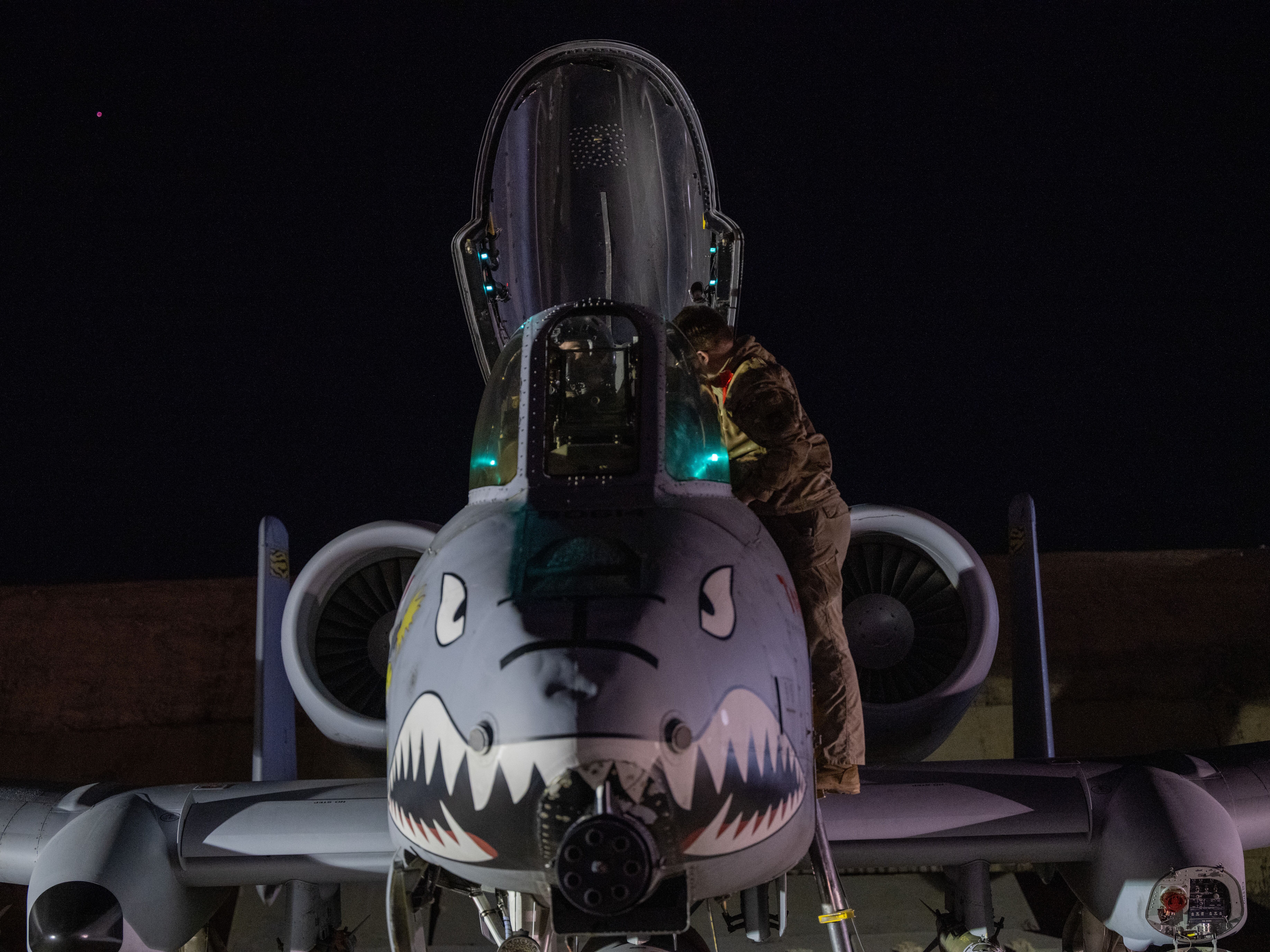 caption: This photo provided by the U.S. Air Force shows a U.S. Airman preparing an A-10 Thunderbolt II for flight from a base in the U.S. Central Command area of responsibility, on Dec. 19, 2025, in support of Operation Hawkeye Strike.