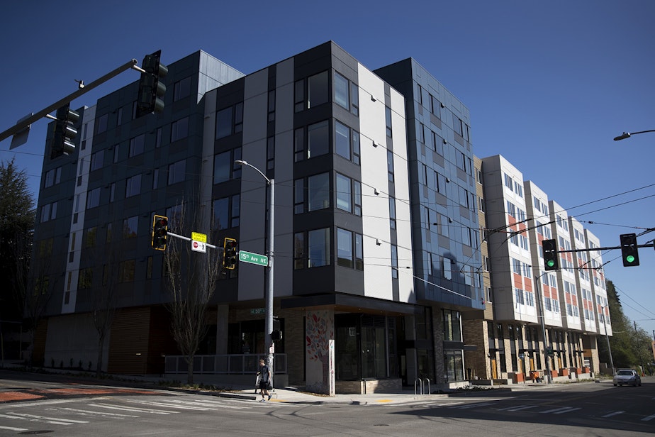 caption: The newly constructed Arbora Court Apartments, with 133 units, is shown on Monday, April 23, 2018, in Seattle. Forty of the apartments have been set aside for families transitioning out of homelessness.
