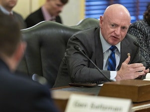 caption: Sen. Mark Kelly, D-Ariz., speaks during a hearing of a Senate Armed Services Committee subcommittee. A combat veteran, Kelly called on the U.S. Marines to explain why wounded troops weren't told the truth about a friendly fire incident in Iraq in 2004.