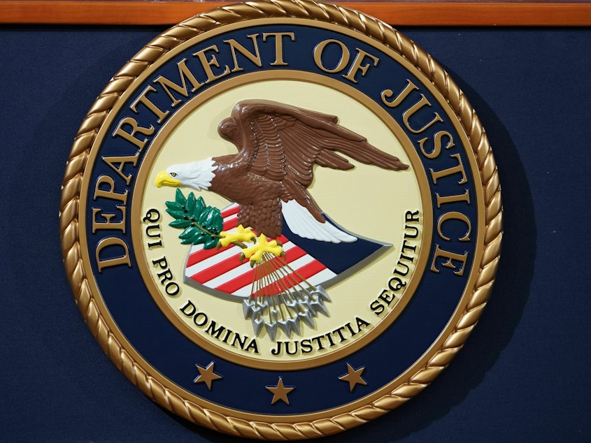 caption: The Justice Department has charged a U.S. Army Reserves major in an alleged years-long fraud scheme targeting Gold Star families.
