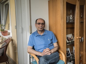 caption: Hassan Mahmoud, 53, is one of the Syrians who testified in a landmark trial in Germany in which a former Syrian security official is charged with crimes against humanity and other crimes for overseeing torture at a prison.