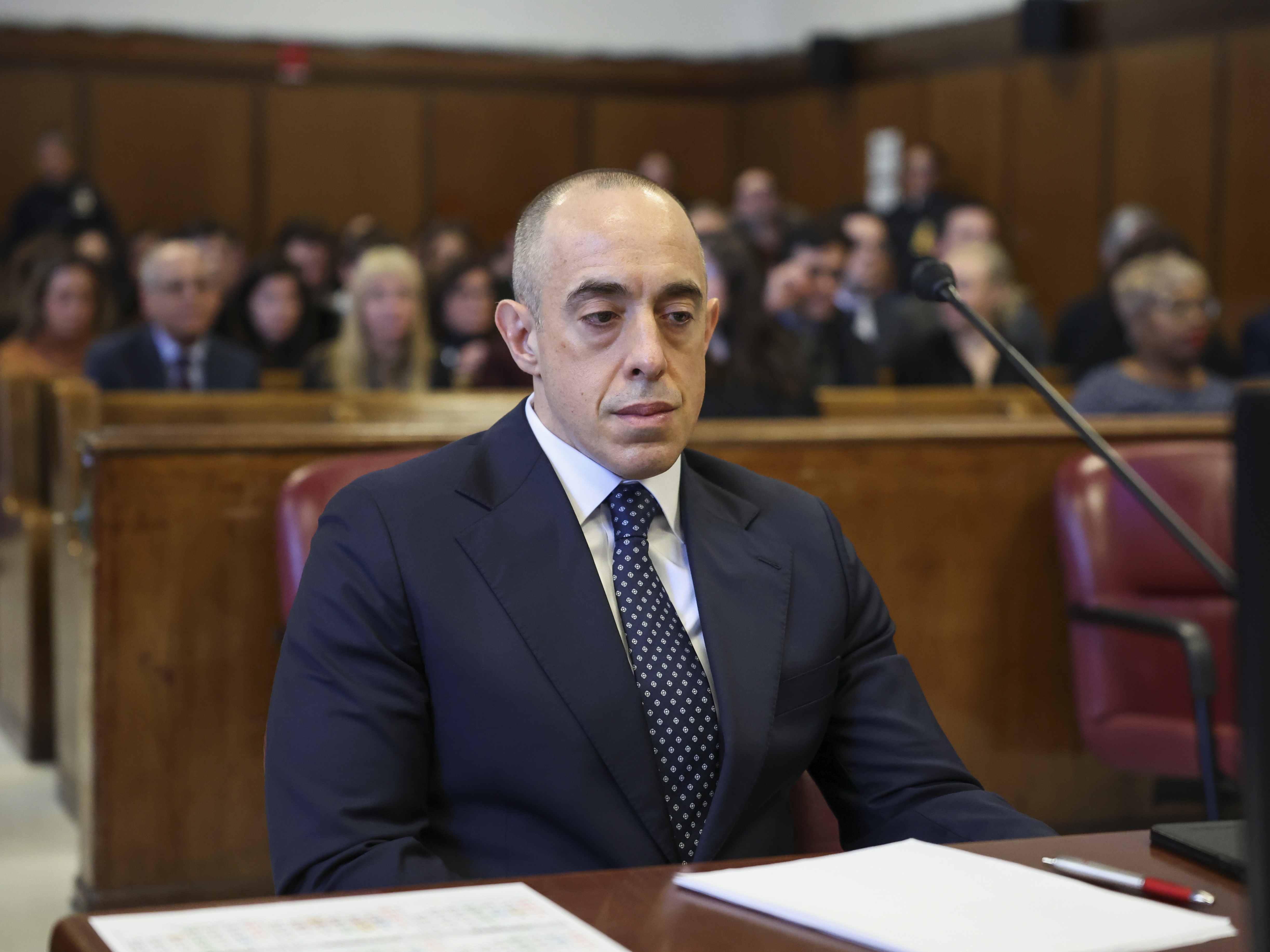 caption: Emil Bove, then President Trump's attorney, looks on as Trump appears remotely for a sentencing hearing in Manhattan Criminal Court last month in New York City, after Trump was found guilty of falsifying business records.