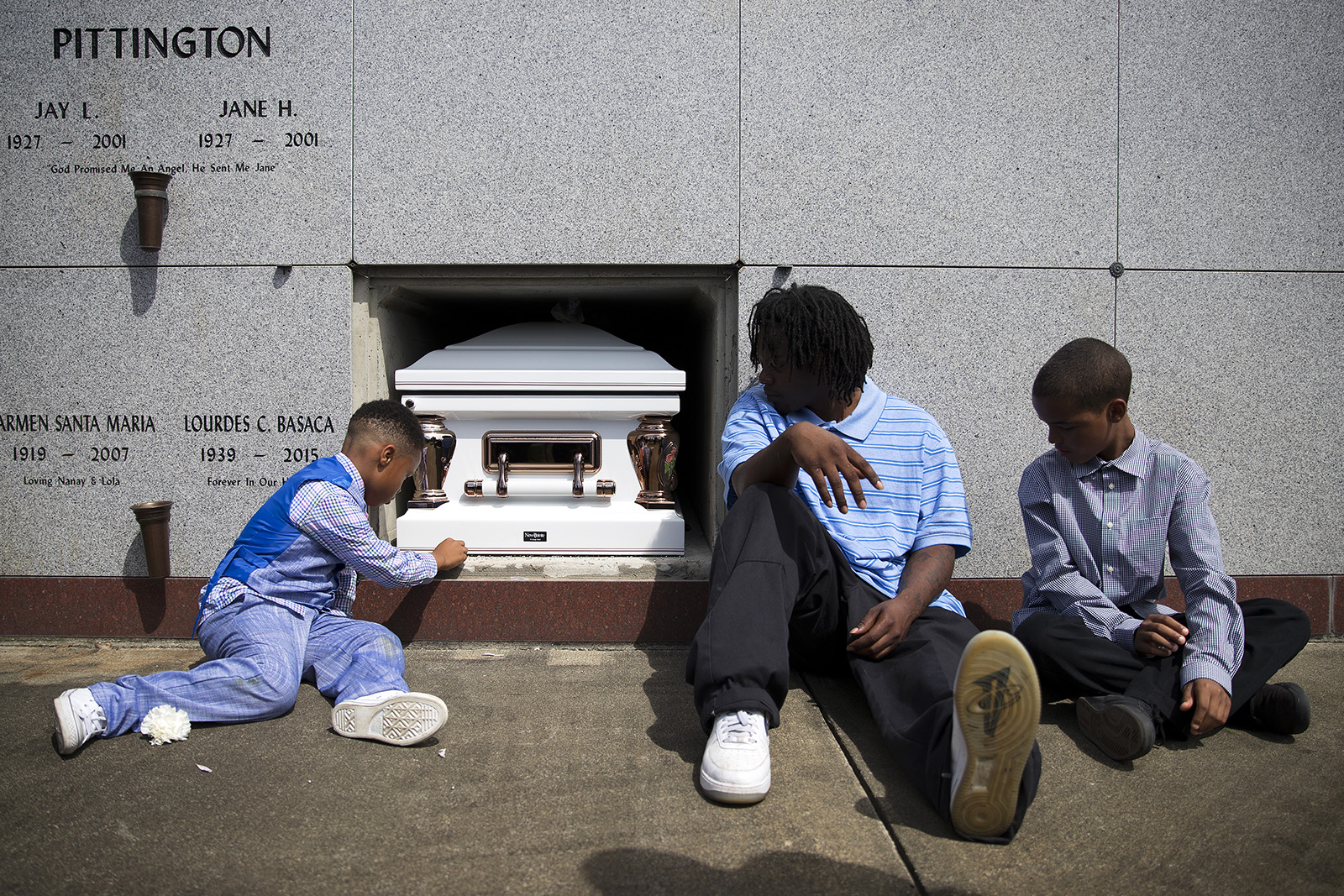 caption: Mourners at the internment of Charleena Lyles at Hillcrest Cemetery in Kent, Washington, on Monday, July 10, 2017.