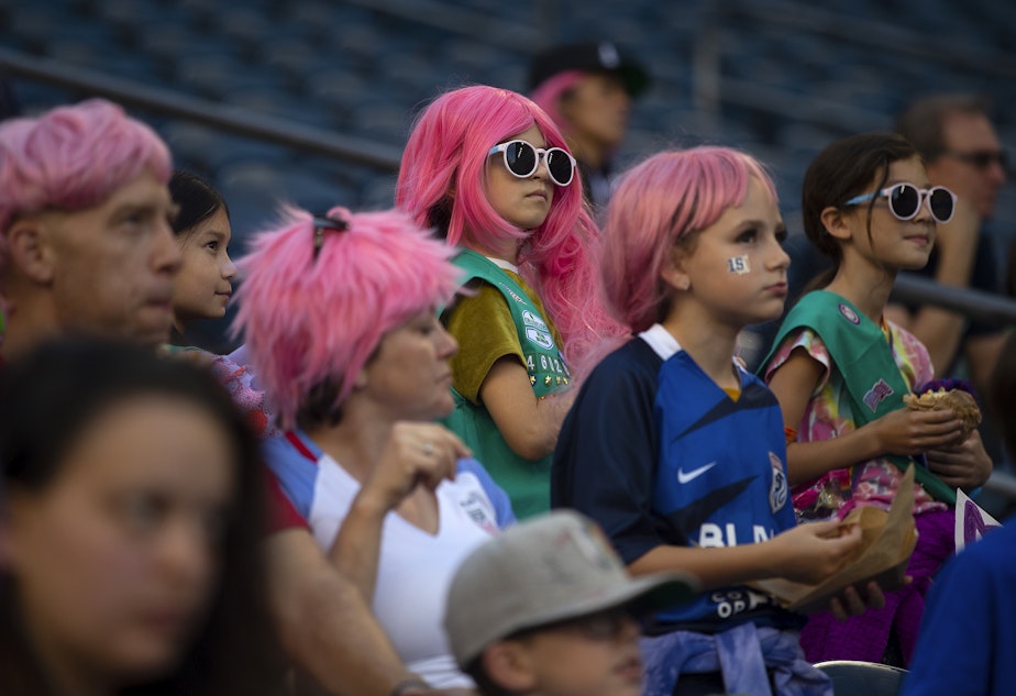 caption: Fans, many wearing pink wigs in honor of Megan Rapinoe, broke an NWSL attendance record of 34,130 during the OL Reign forward’s last regular-season NWSL home game against the Washington Spirit on Friday, Oct. 6, 2023, at Lumen Field in Seattle.