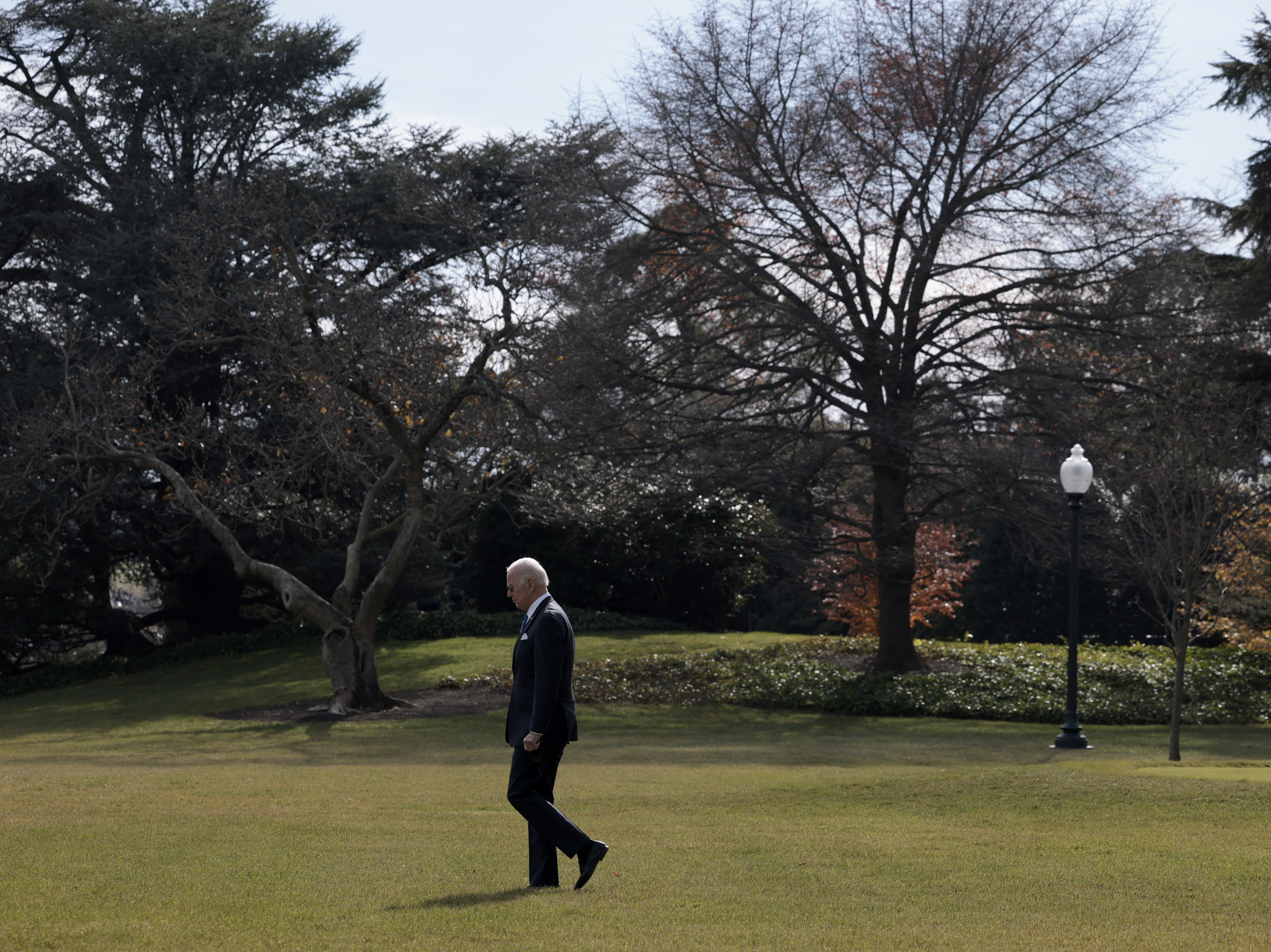 caption: President Biden walks to Marine One outside the White House on Dec. 2, 2021.