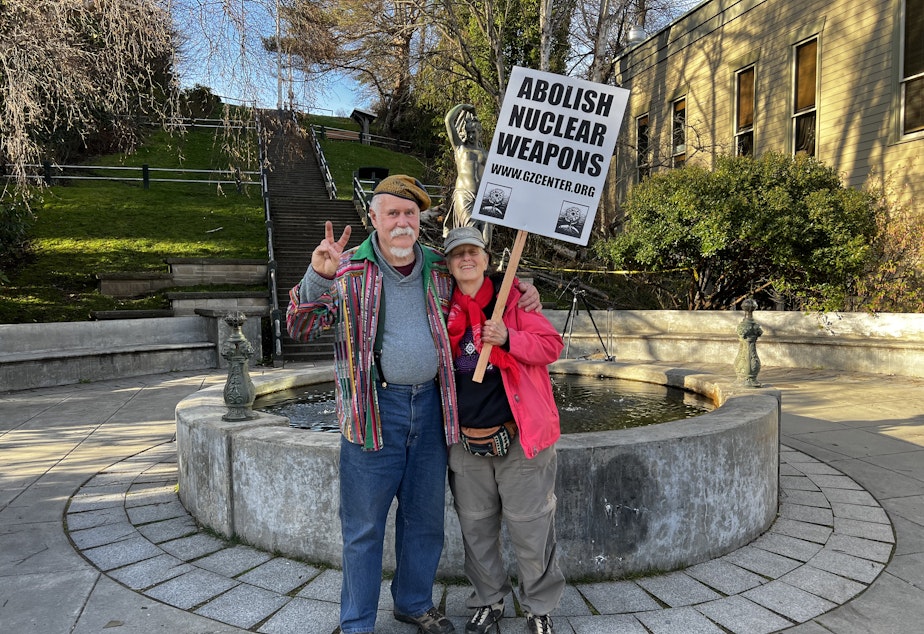 caption: Doug Milholland (left) and Carolyn Wildflower (right) have both spent decades protesting nuclear weapons in Washington State and worldwide.