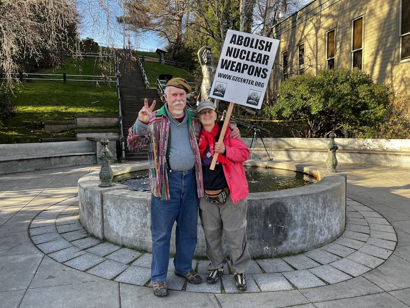 caption: Doug Milholland (left) and Carolyn Wildflower (right) have both spent decades protesting nuclear weapons in Washington State and worldwide.
