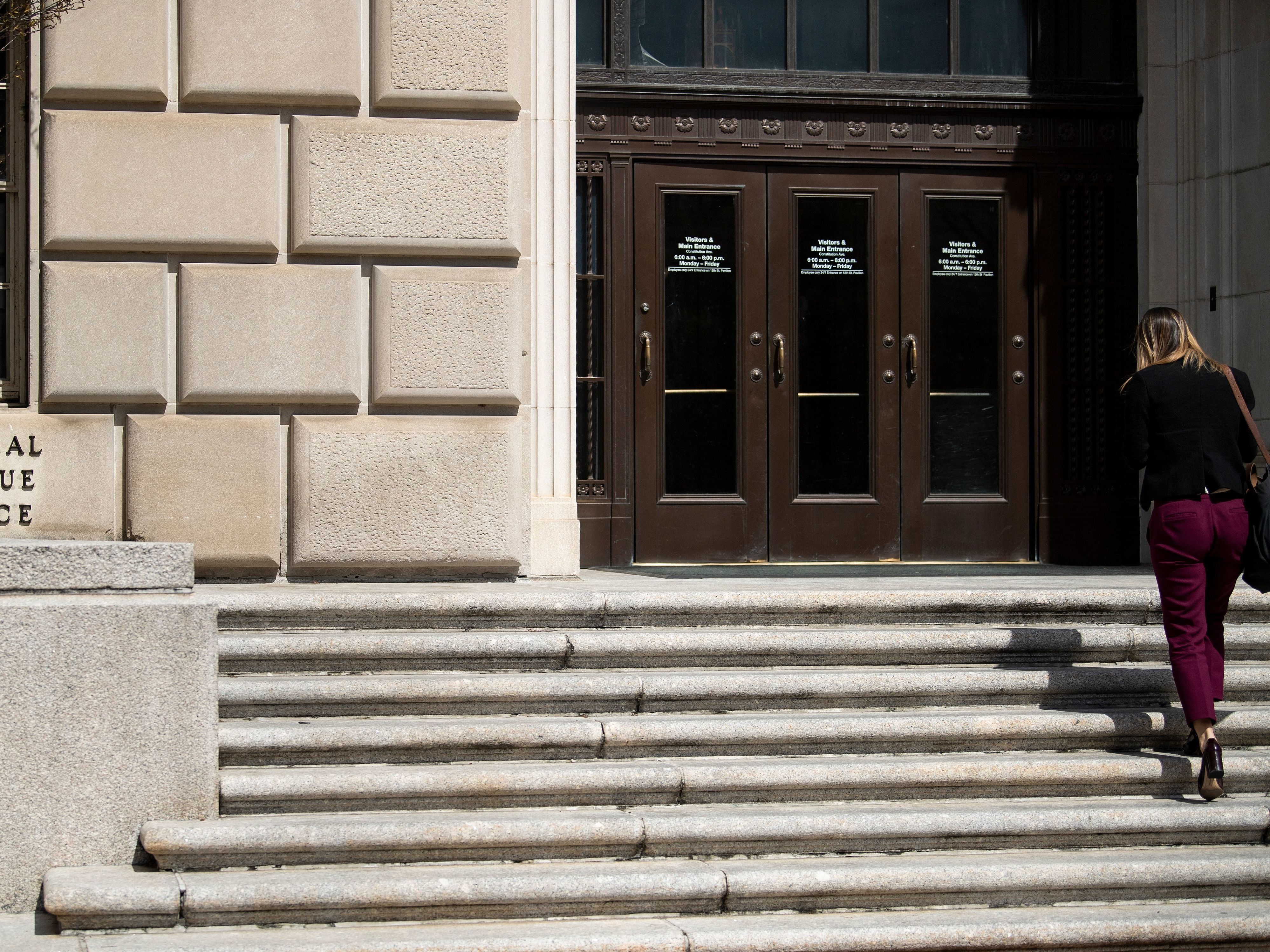 caption: The IRS is calling back thousands of workers, but says they must provide their own face coverings because the agency has not yet secured enough personal protective equipment.