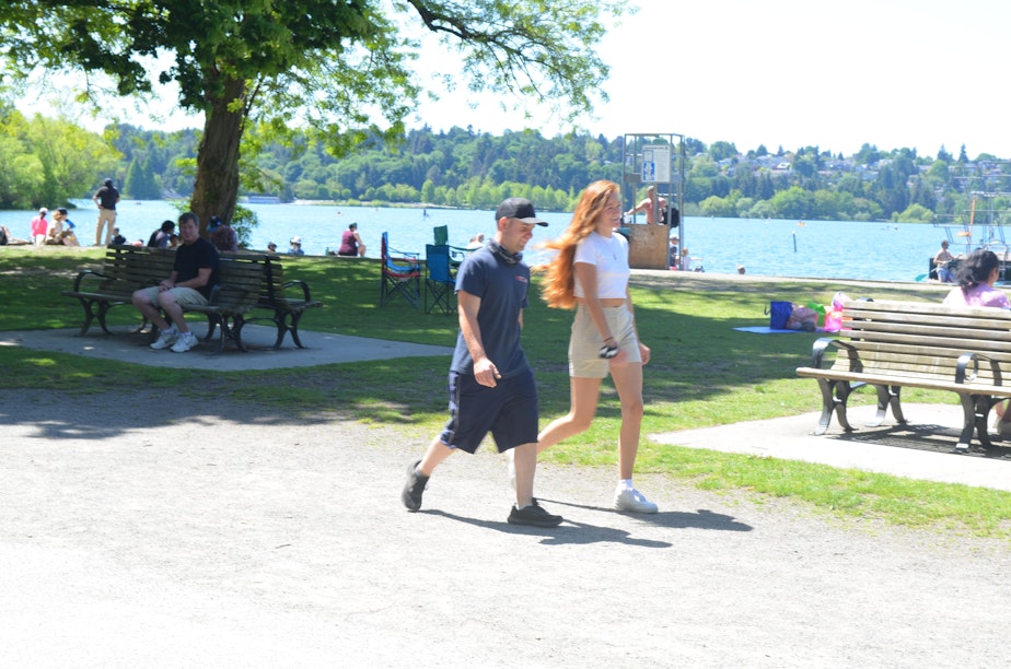 caption: In mid-May, almost everyone walking around Seattle's Green Lake was maskless.