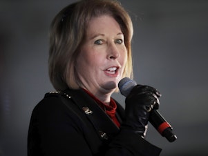 caption: Attorney Sidney Powell, then an attorney for Donald Trump, speaks during a rally in Alpharetta, Ga., on Dec. 2, 2020. Powell has now pleaded guilty as part of deal with prosecutors over efforts to overturn Trump's loss in Georgia.