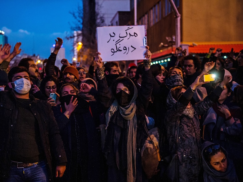caption: Mourners chant while gathering in Tehran over the weekend for a vigil for victims of Iran's unintentional downing of a Ukrainian airliner. As protests continue, Iran says it has made several arrests in the catastrophe.
