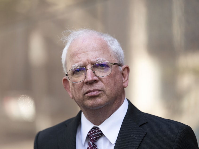 caption: Attorney John Eastman stands outside the California State Bar Court in downtown Los Angeles. The State Bar is seeking to revoke Eastman's law license over his work on former President Donald Trump's effort to overturn the 2020 election.