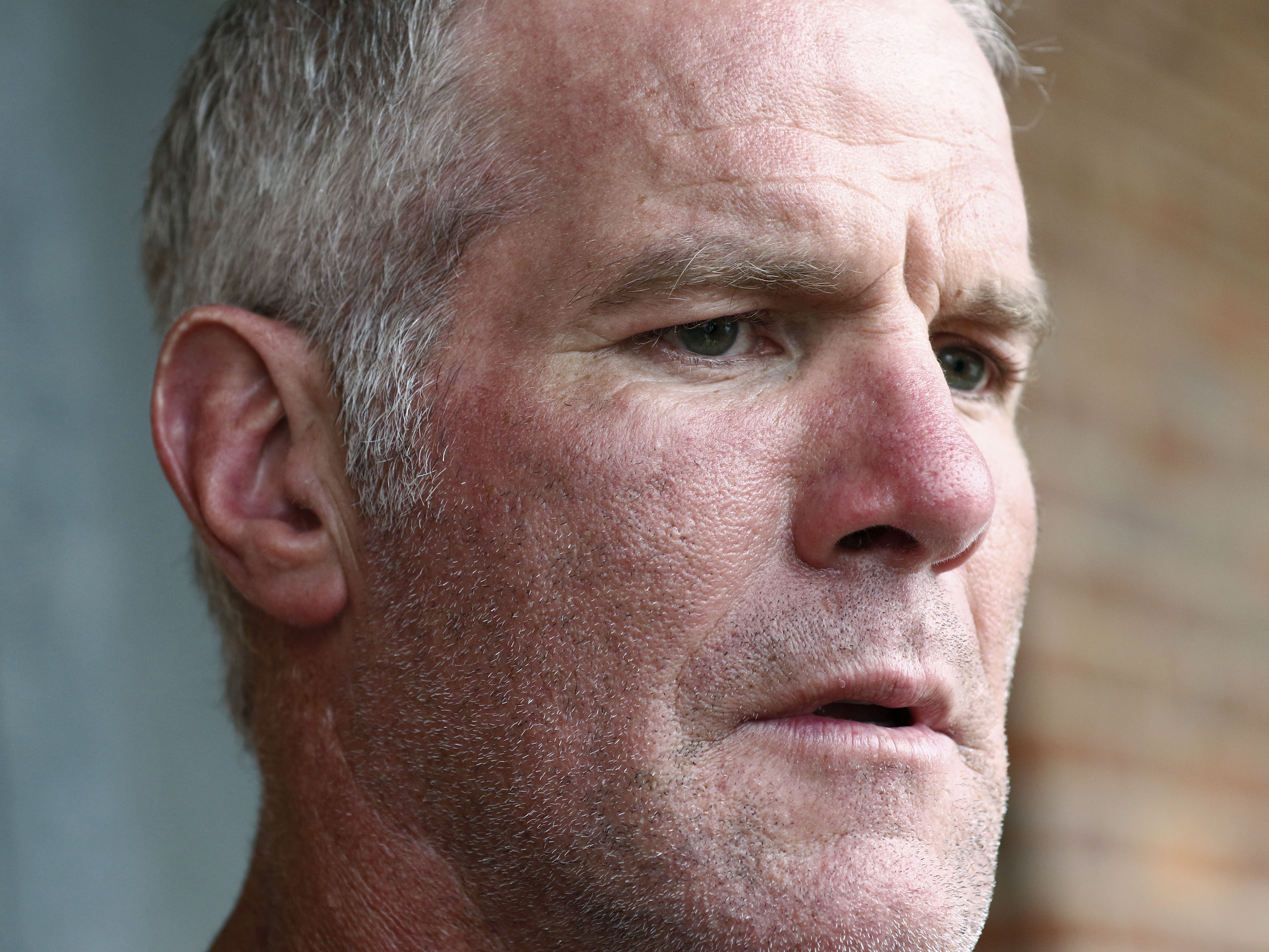 caption: Former NFL quarterback Brett Favre is pictured in 2018. The governor of Mississippi in 2017 was "on board" with a plan for a nonprofit group to pay Brett Favre more than $1 million in welfare grant money so the retired NFL quarterback could help fund a university volleyball facility, according to text messages.