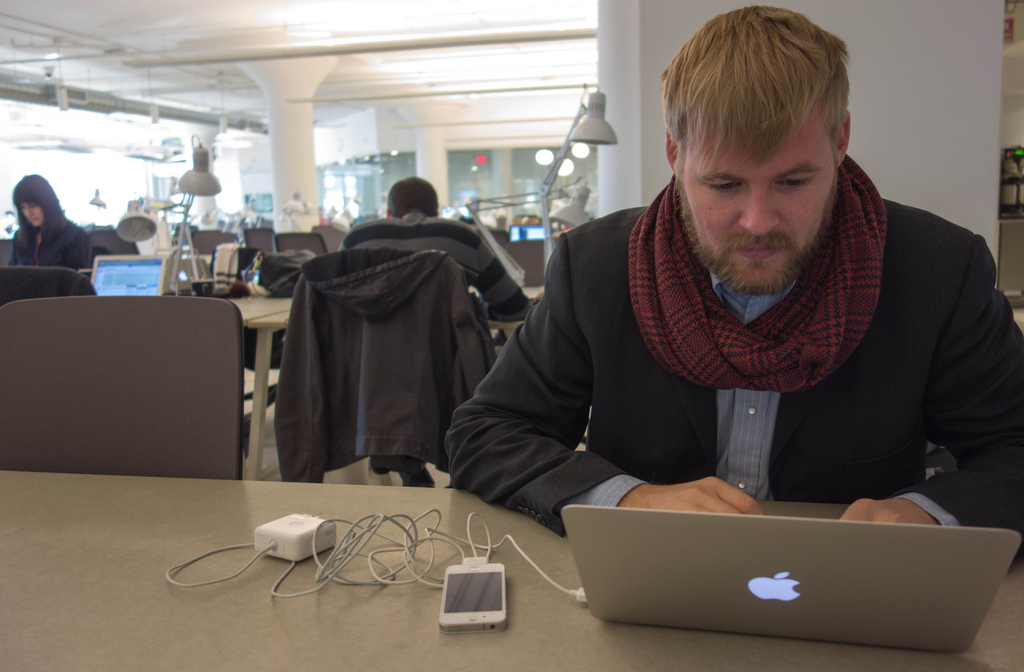 caption: A worker at a WeWork location. The collaborative work space provide has opened a location in South Lake Union.