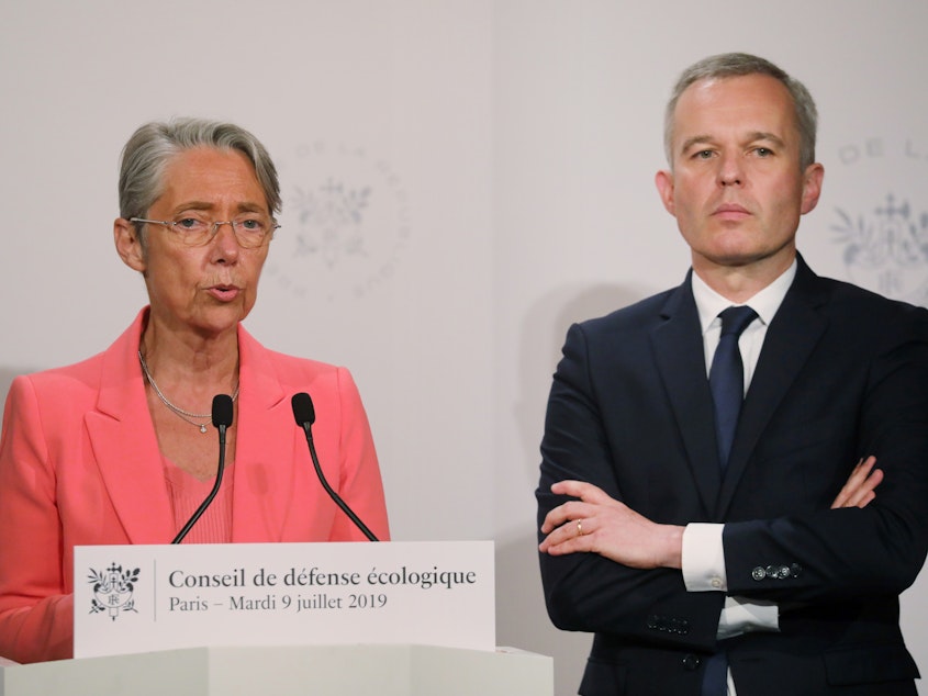caption: French Transport Minister Elisabeth Borne says a new tax on airfares "is a response to the ecological urgency and sense of injustice expressed by the French." She's seen here with Minister for the Ecological and Inclusive Transition Francois de Rugy.