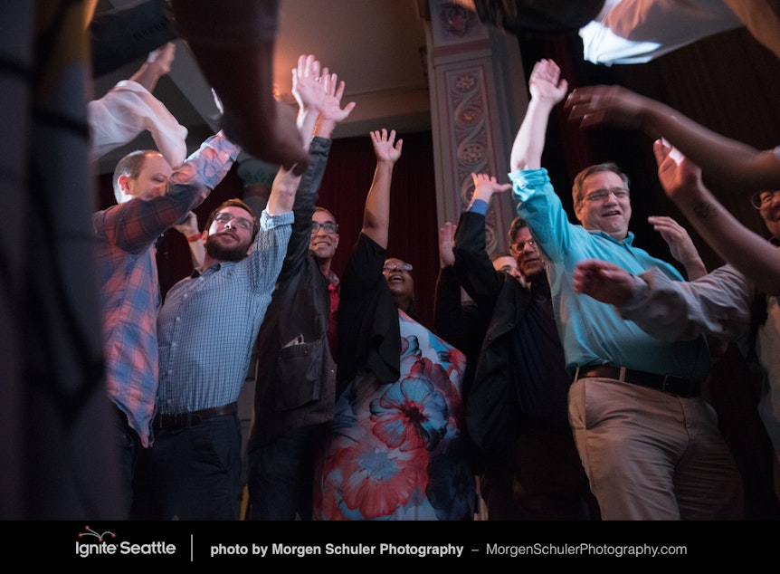 caption: Speakers get ready for Ignite Seattle 34 at the Egyptian Theatre