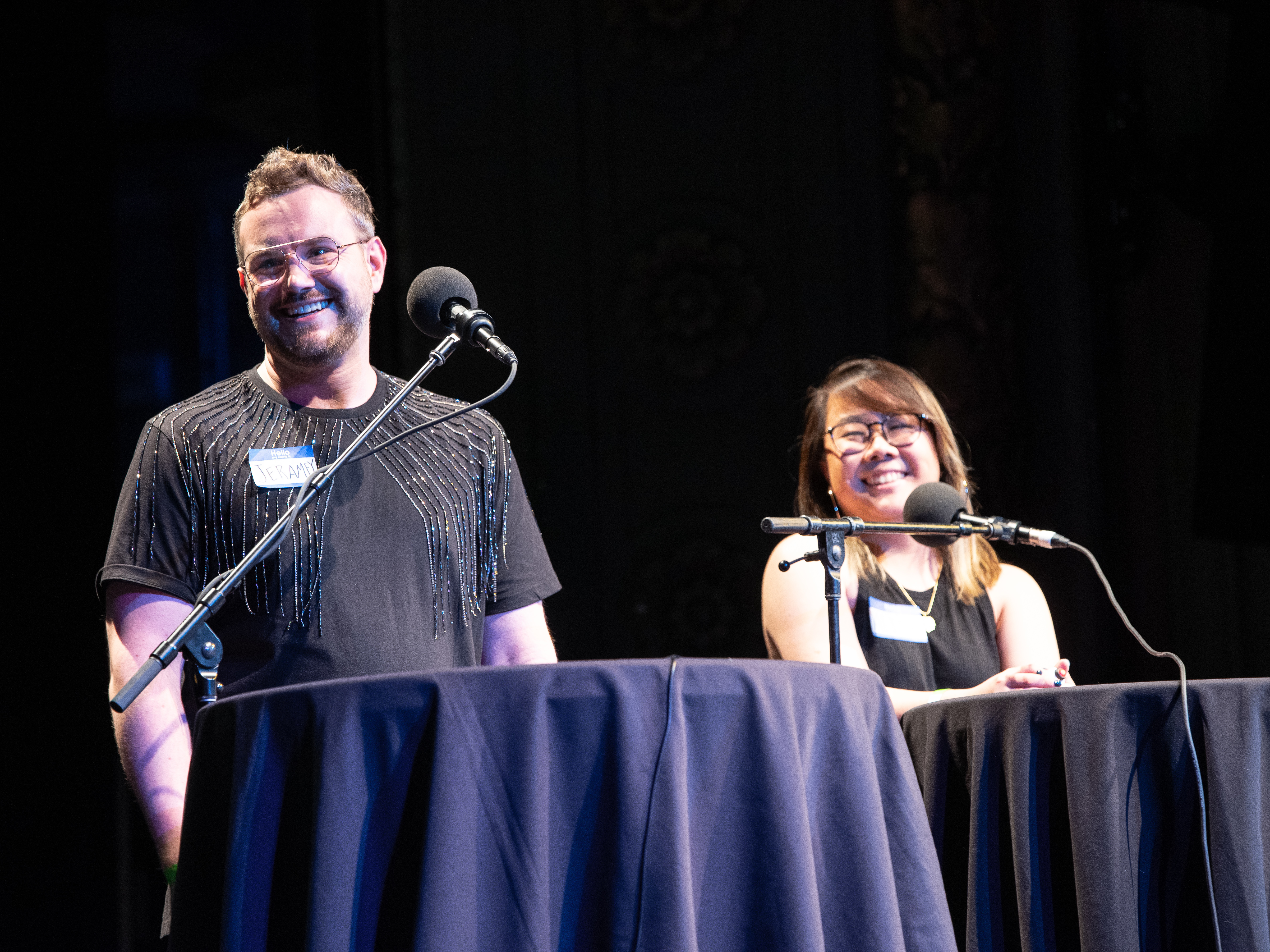 caption: Contestants Jeramey Kraatz and Alice Zhu appear on <em>Ask Me Another</em> at the Majestic Theatre in Dallas, Texas.