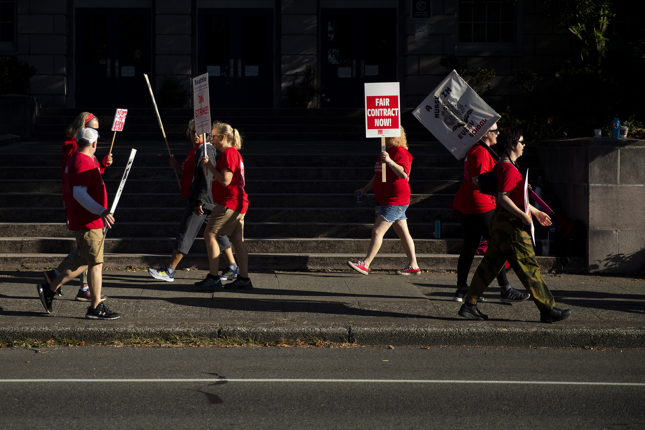 caption: Seattle Public Schools educators walk the picket line on Thursday, September 8, 2022, outside of the Salmon Bay School on Northwest 65th Street in Seattle.