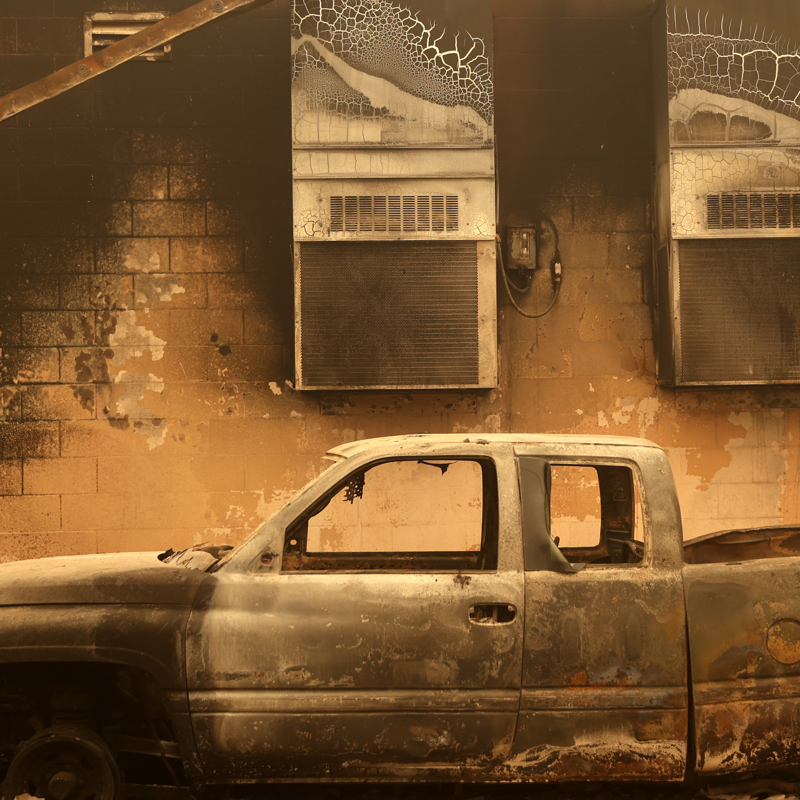 caption: A burned truck sits parked next to a property that was destroyed by the Dixie Fire on August 11, 2021, in Greenville, California. The Dixie Fire, which has incinerated over 500,000 acres, is the second-largest recorded wildfire in state history. The fire stands at 30 percent contained.