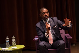 caption: Rev. Starsky Wilson at Seattle Public Library