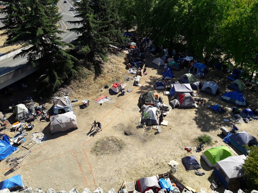 caption: The tent city where Jungle residents are being encouraged to move.