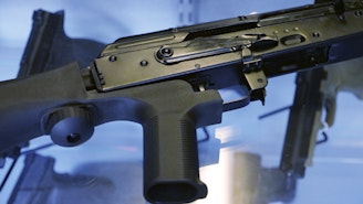 caption: A bump stock is attached to a semi-automatic rifle. The U.S. Supreme Court, Friday, June 14, 2024, struck down a ban on the rapid-fire rifle bump stock used by the gunman who rattled off over 1,000 bullets in 11 minutes in Las Vegas in 2017.
