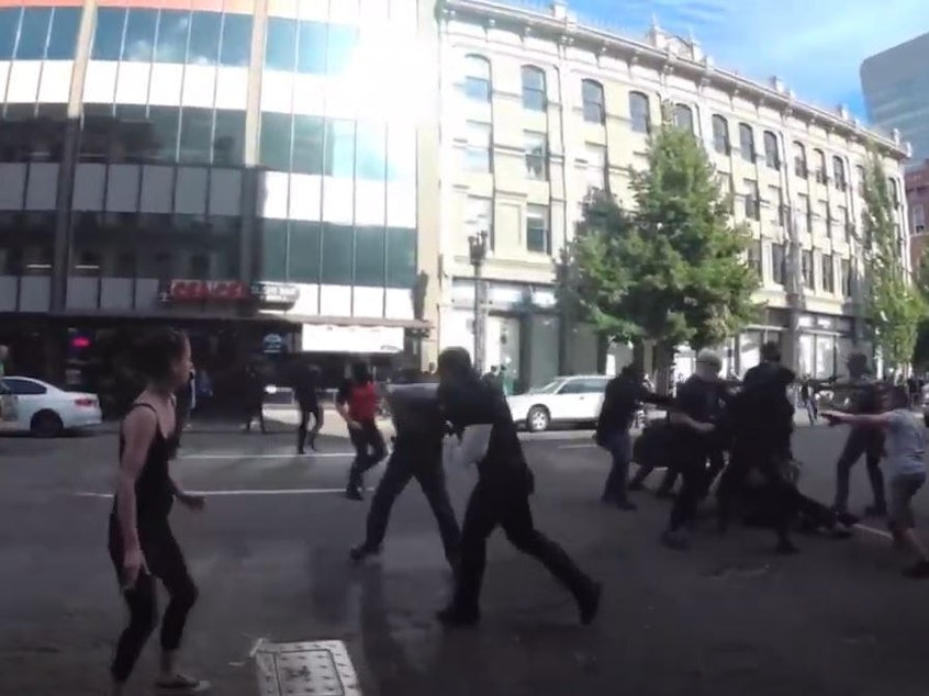 caption: In June 2018, Ethan Nordean punched a counterprotester in the jaw and shoved him to the pavement in Portland, Oregon. The Proud Boys have since used the video of that punch as a rallying cry.