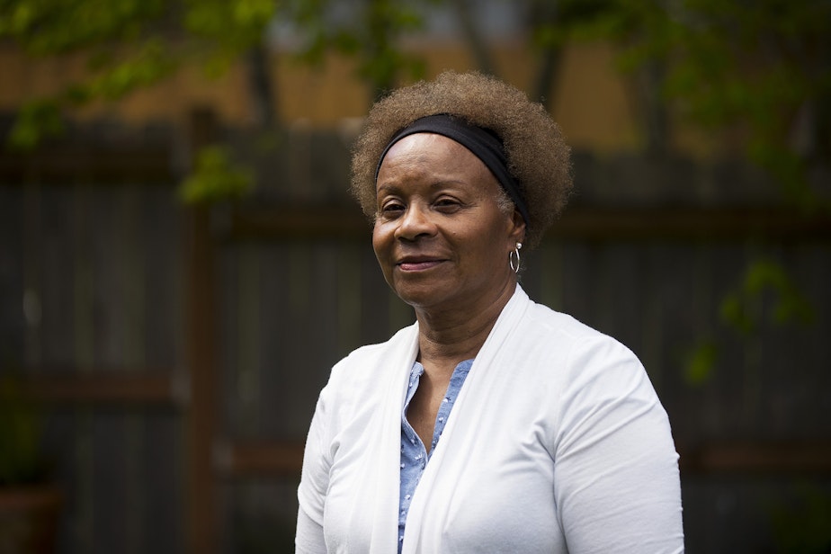 caption: Joyce Epps stands for a portrait in the backyard of her home on Tuesday, May 10, 2022, in Renton. 
