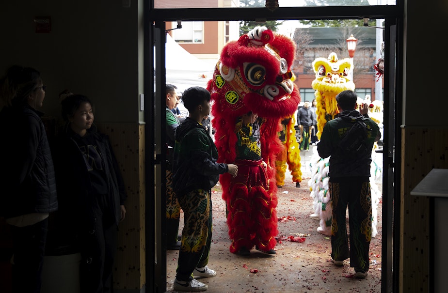 caption: Mak Fai Dragon and Lion dancers perform during the Lunar New Year celebration on Saturday, Feb. 4, 2023, in Seattle’s Chinatown-International District.
