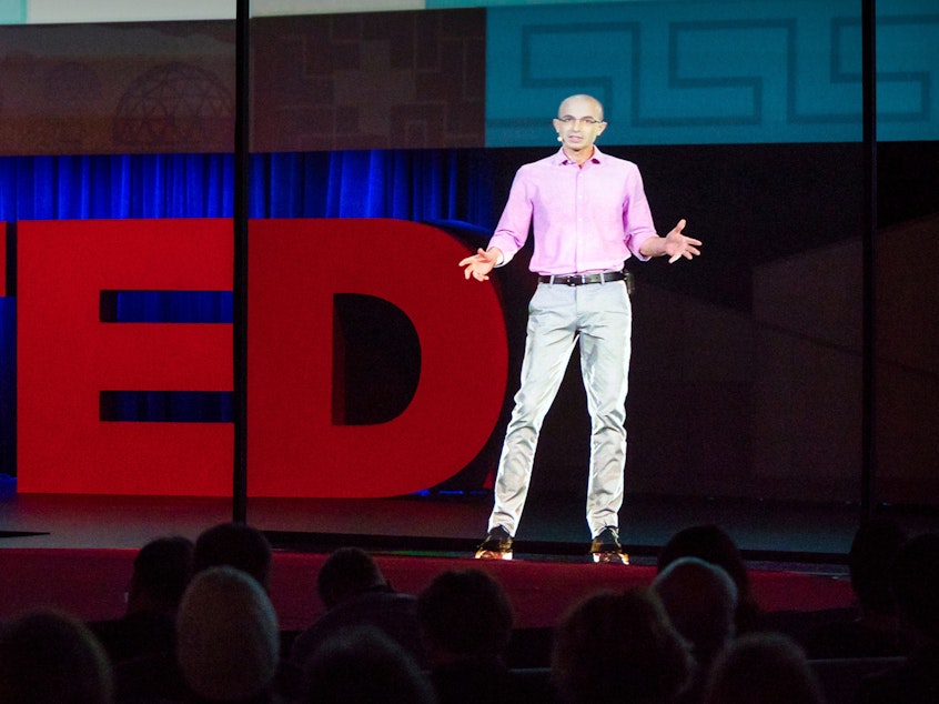 caption: Yuval Noah Harari on the TED stage.