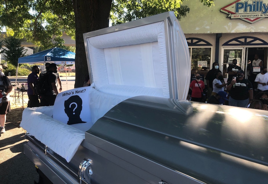 caption: Briscoe says people are "weary" and overwhelmed from rising incidents of gun violence. Community groups staged a protest in 2021 to raise awareness.